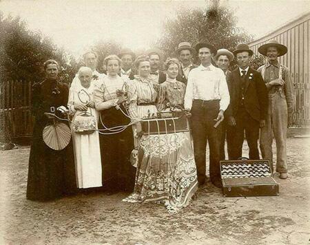 Photograph of people around the Edison machine